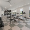 fitness center with free weights and cardio equipment