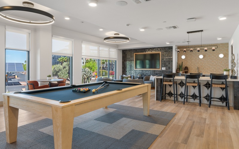 resident clubhouse with wetbar, tv, and pool table