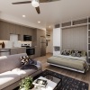 living room with bed and ceiling fan 